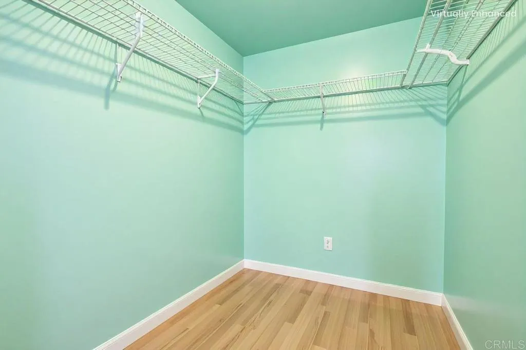 Primary Walk-In Closet - Virtually Staged