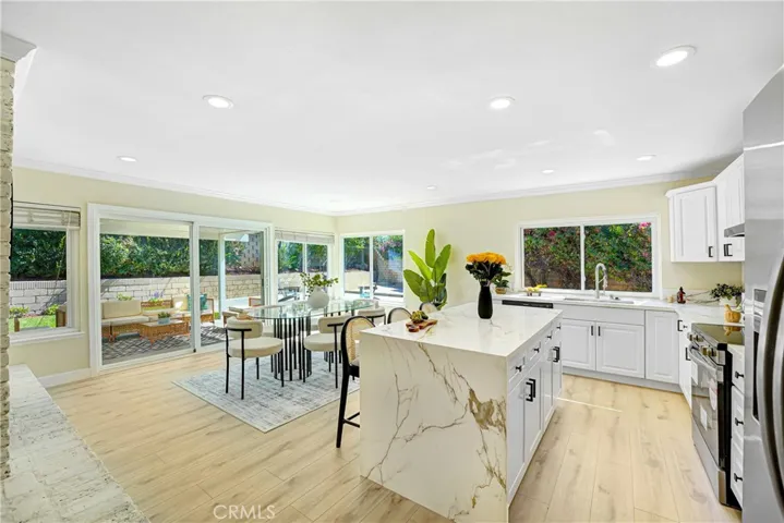 newly remodeled kitchen with waterfall island
