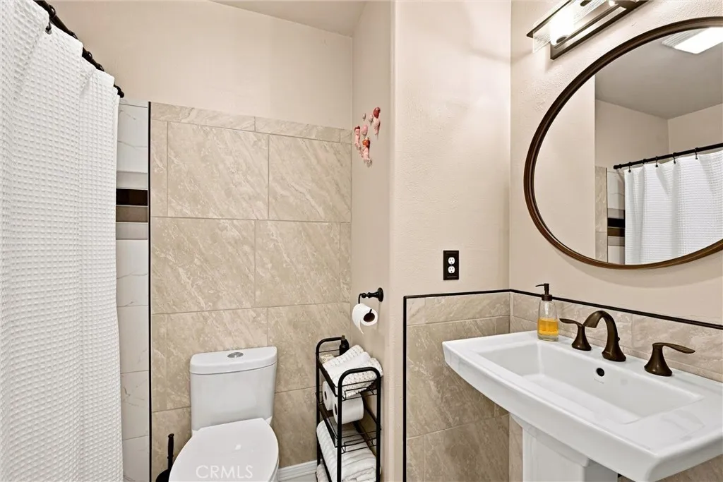 Hall bath with custom tile surround