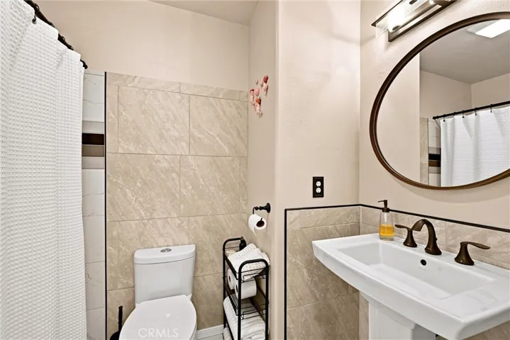Hall bath with custom tile surround