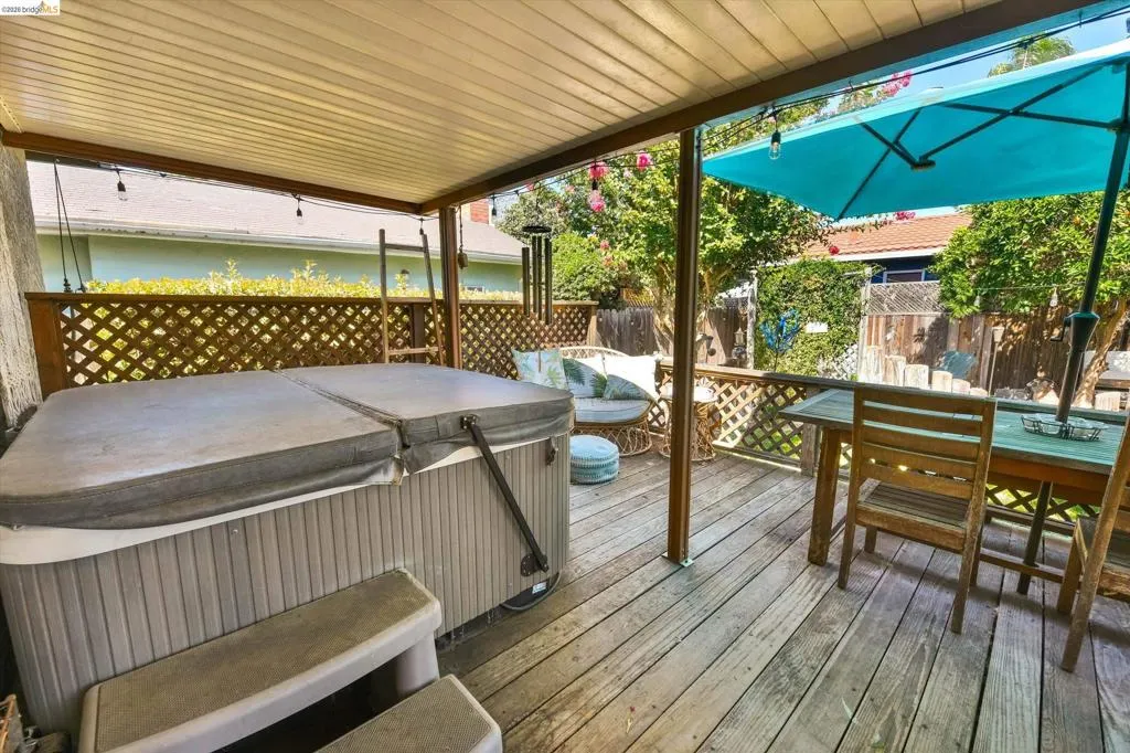 Covered outdoor deck with wood-finish flooring