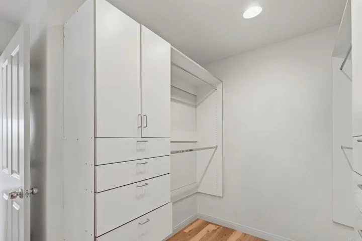 With cabinets on both sides.