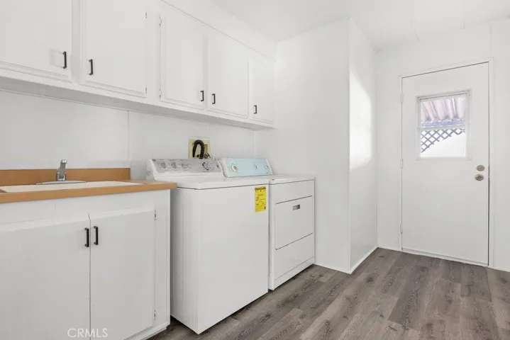 Laundry Room & Side exit to carport