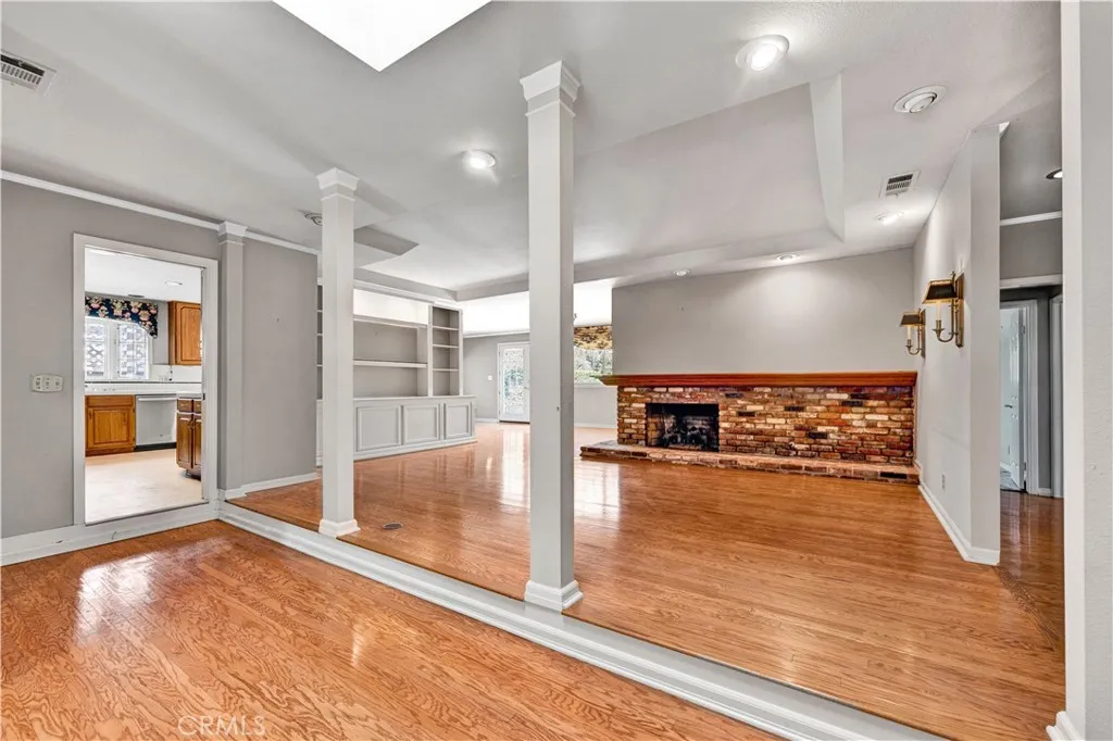 ANOTHER VIEW OF THE LIVING ROOM WITH FIREPLACE