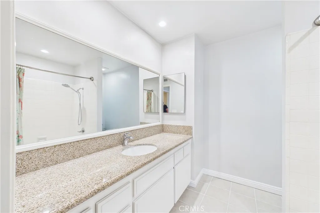 Second larger primary vanity in bath