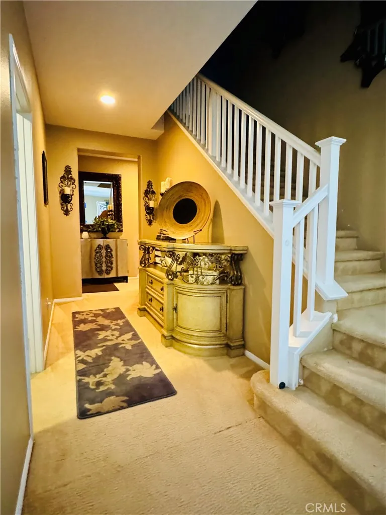 Downstairs Guest Bath and Staircase to Upstairs Private Living Spaces