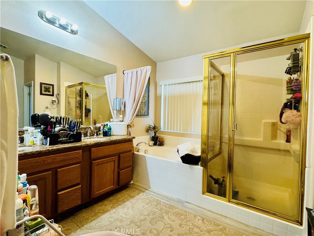 Primay Ensuite Bathroom Grooming Area, Soaking Tub and Enclosed Walk-in Shower