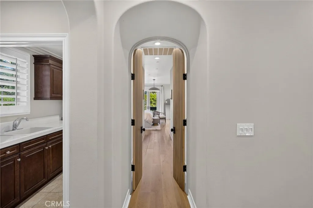 Custom doors opening to the primary suite
