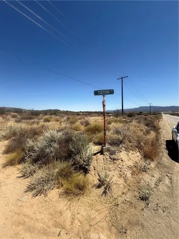 corner of paved road and dirt road