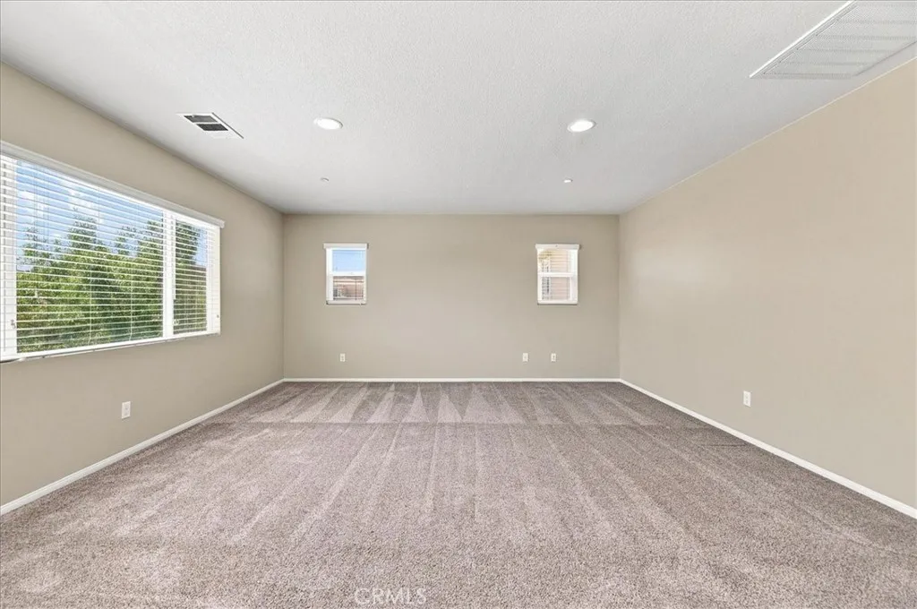 Primary Bedroom with Recessed Lighting