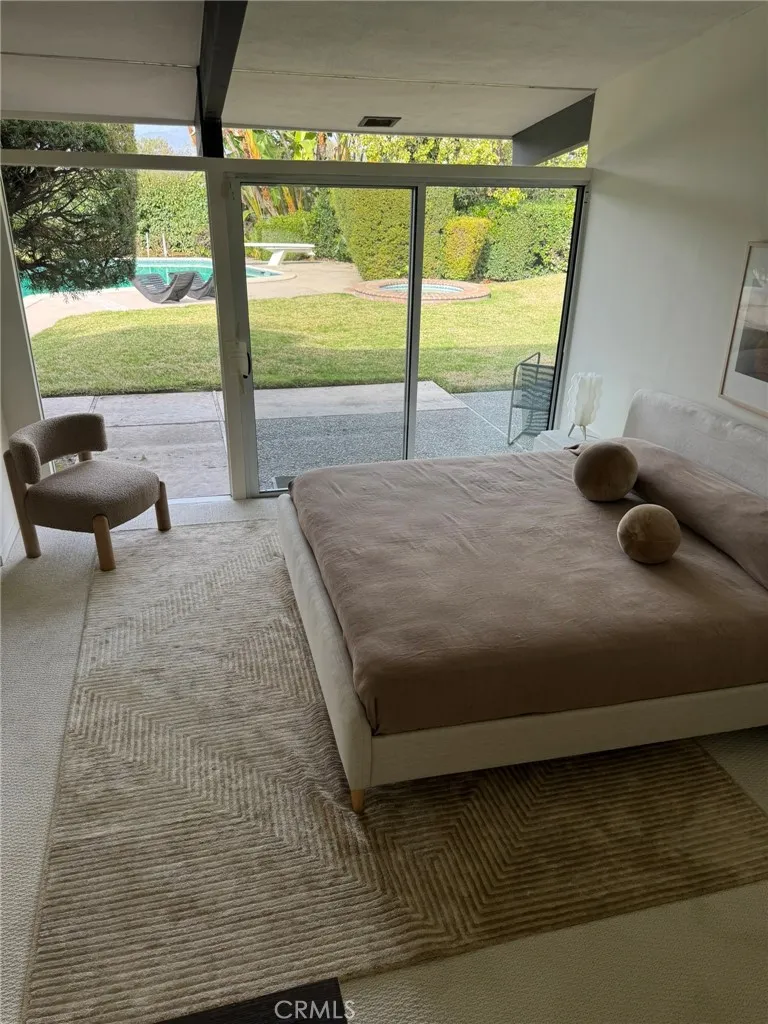 Bedroom with view to Pool area Bedroom with view to Pool area