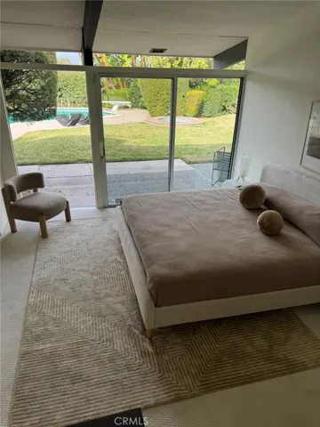 Bedroom with view to Pool area