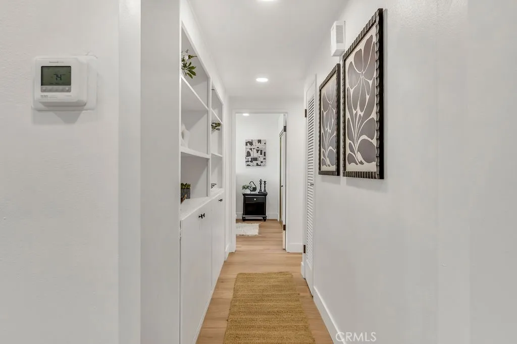 Hallway to three downstairs bedrooms