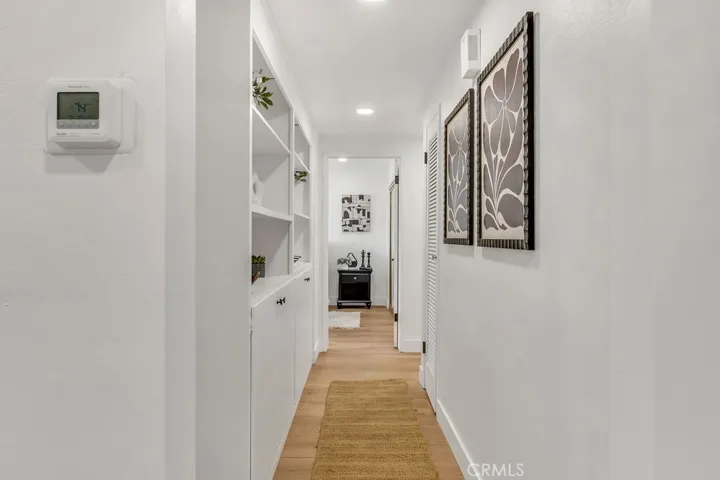 Hallway to three downstairs bedrooms