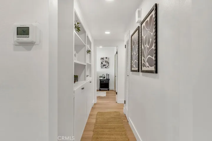 Hallway to three downstairs bedrooms