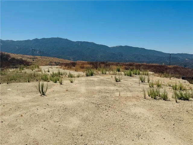 Beautiful panoramic view of the property featuring stunning mountain views, open space, and endless possibilities for your future vision.