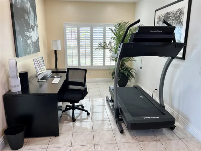 Formal dine used as an office and treadmill area