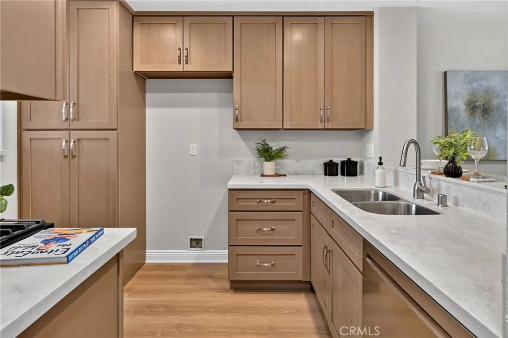 The kitchen has new wood cabinets, quartz countertops, and Stainless Steel LG appliances