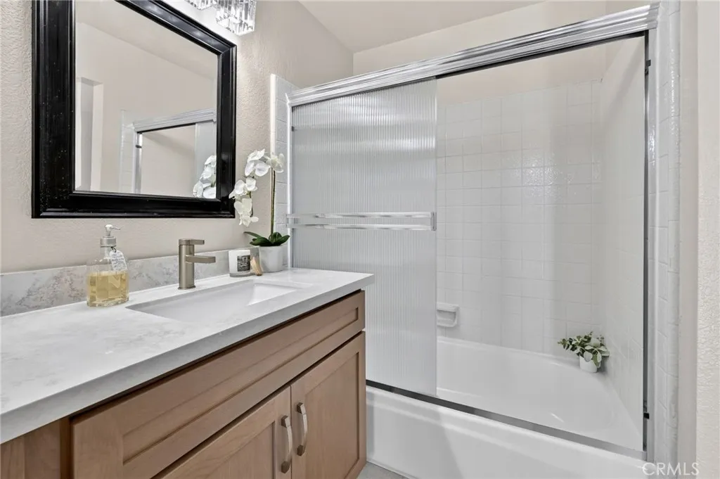 The new vanity and shower/tub in the primary bathroom