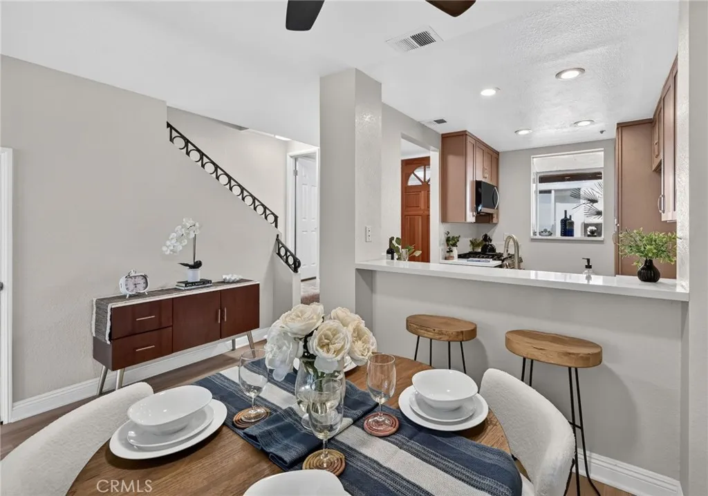 The staircase sits just off the dining room and kitchen.