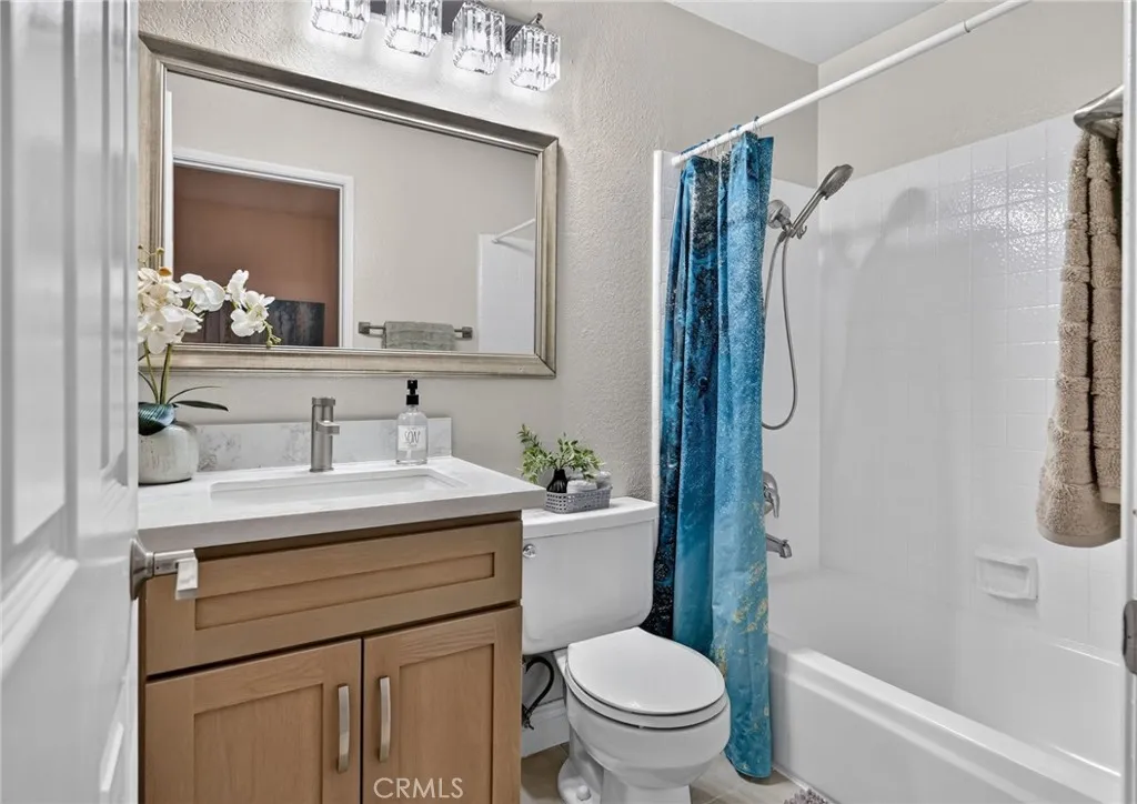The other upstairs bathroom is attached the second bedroom.  It has a new sink/vanity and a tub/shower combo