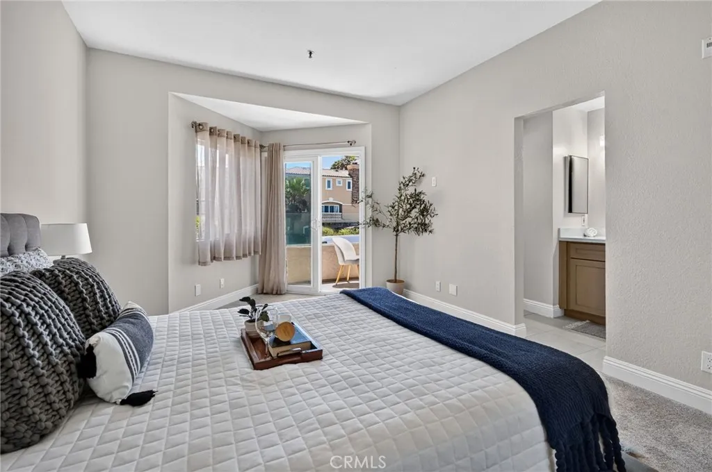 Primary Bedroom with its private bathroom, patio and ocean view