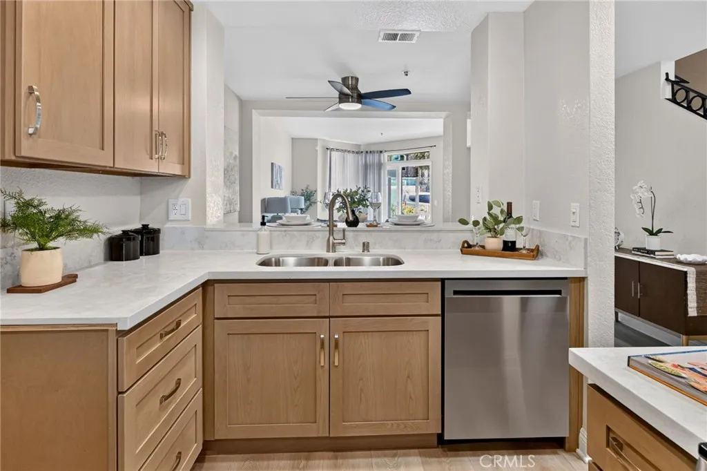 The kitchen has new wood cabinets, quartz countertops, and Stainless Steel LG appliances