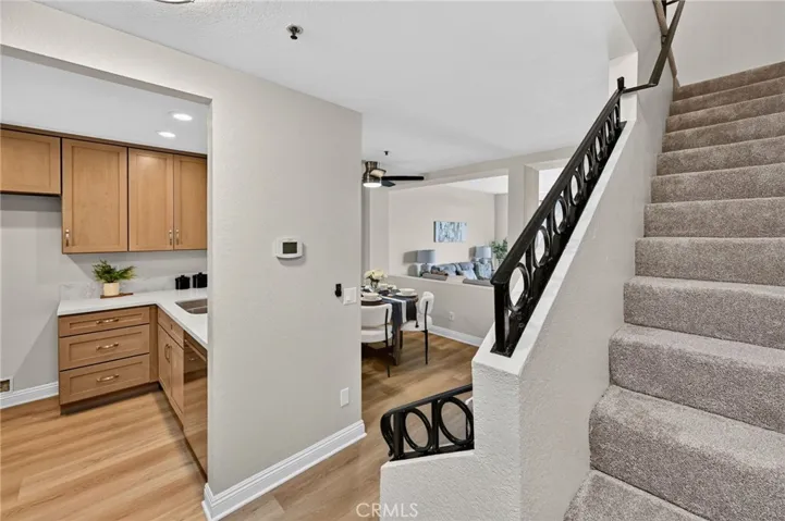 The stairs leading upstairs has new neutral carpeting