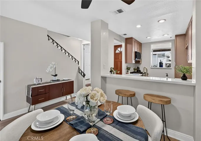 The staircase sits just off the dining room and kitchen.