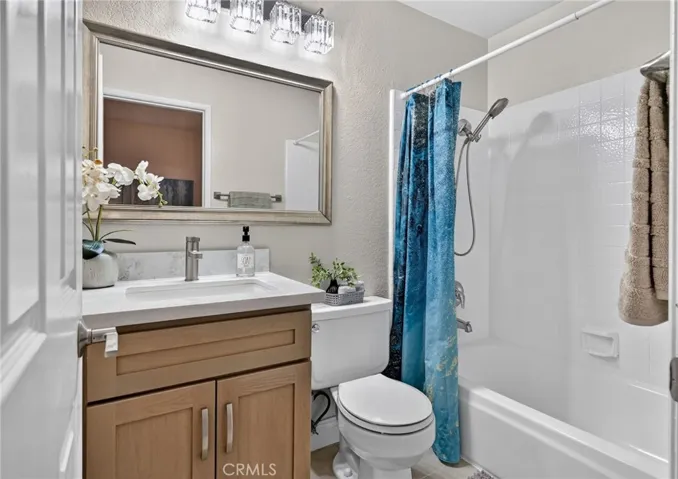 The other upstairs bathroom is attached the second bedroom.  It has a new sink/vanity and a tub/shower combo