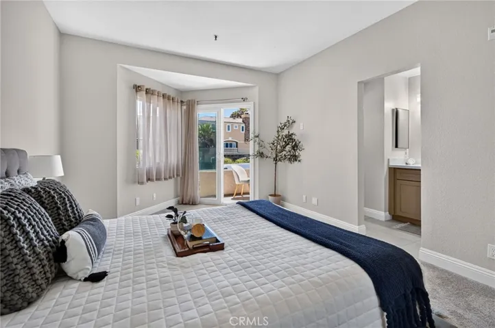 Primary Bedroom with its private bathroom, patio and ocean view