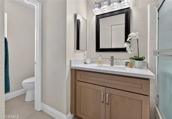 Primary Bathroom has a brand new vanity, lighting, and faucet fixtures