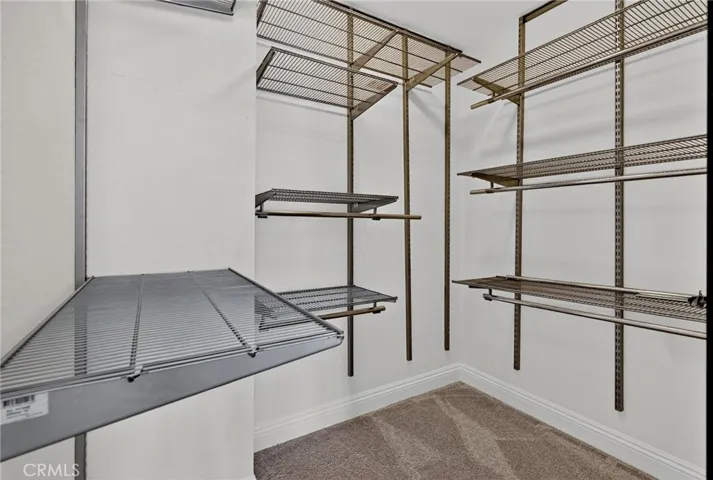 Spacious walk in closet in the primary bedroom