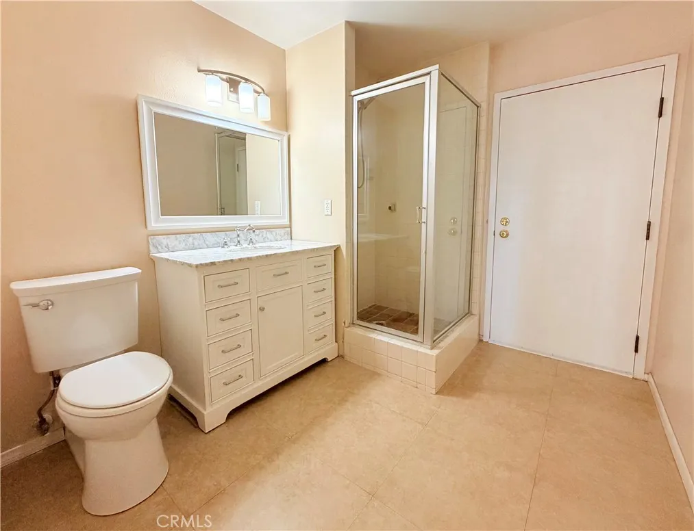 Bathroom Downstairs with door to exit condo