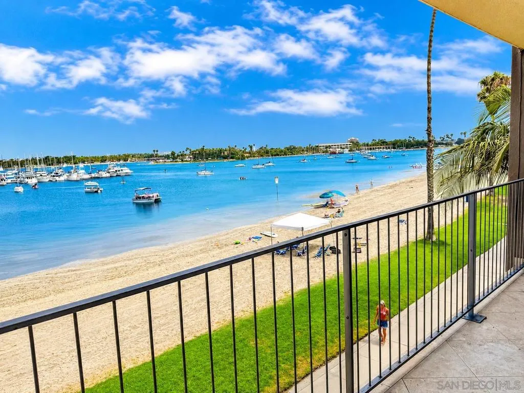 Perched directly on the sand along Bayside Walk, with the Pacific Ocean just a few hundred feet to the west.