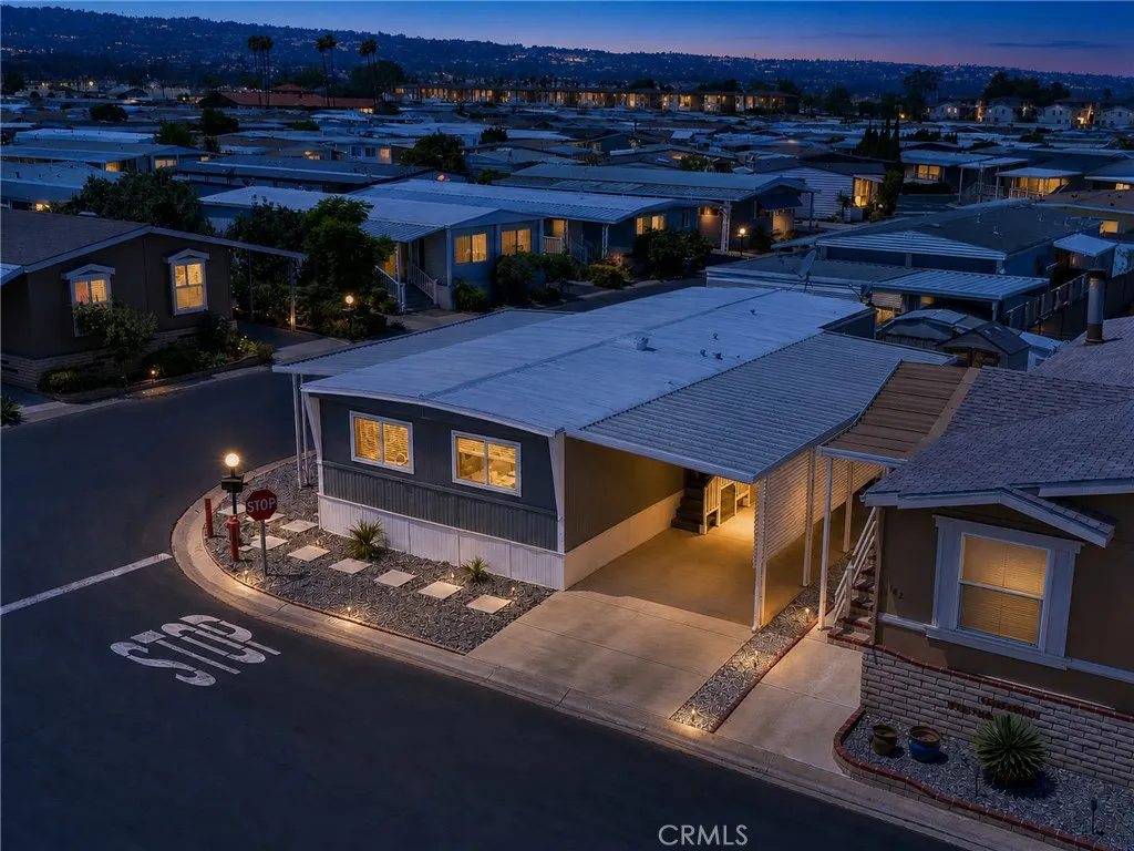 Photo has been touched up to give idea of property in evening.