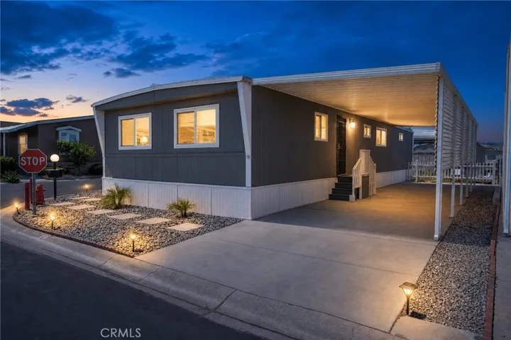 Photo has been touched up to give idea of property in evening.