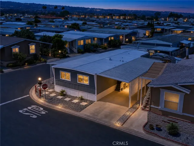 Photo has been touched up to give idea of property in evening.