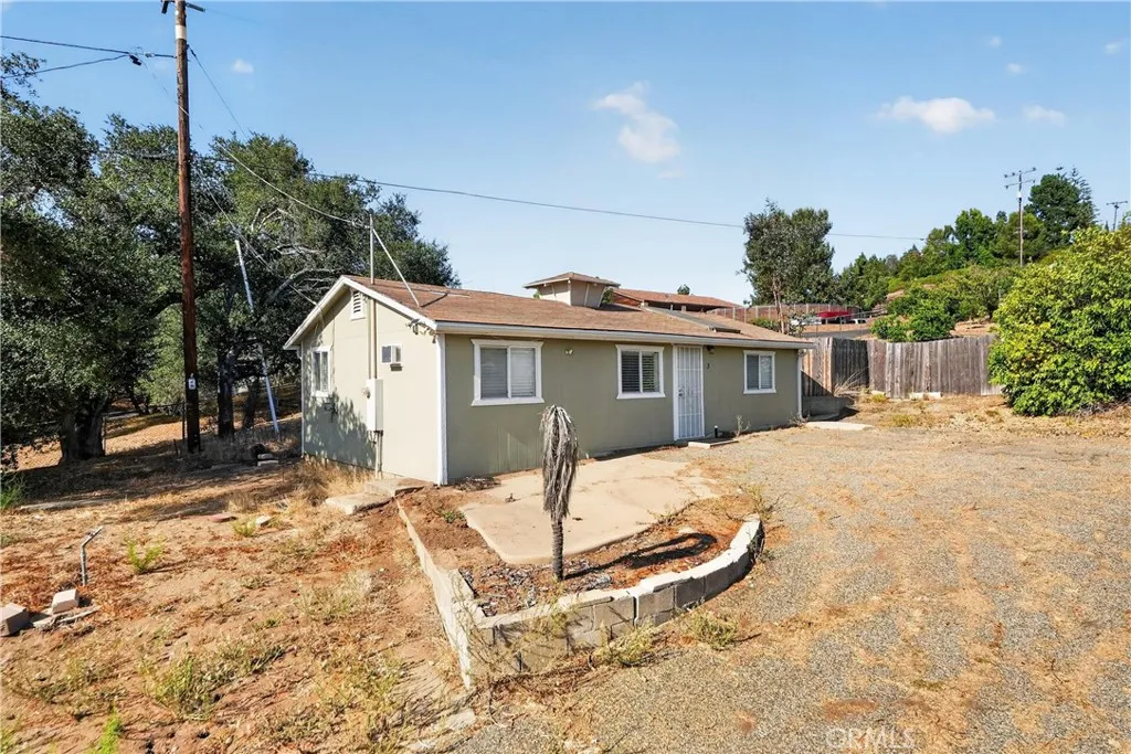 ADDITIONAL VIEW OF UNIT #1 AT THE NE CORNER. NOTE:  UTILITY POLES ARE  RUNNING ON THE NORTHERLY LINE.