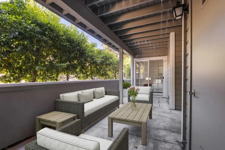 Covered outdoor patio featuring a concrete surface and a sliding glass door entry