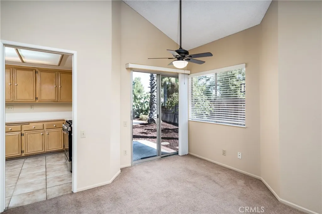 Dining area with slider to backyard.