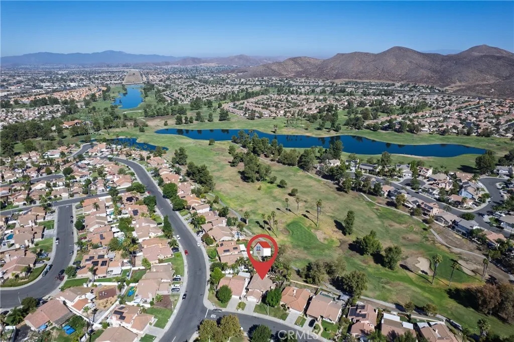 Beautiful aerial view of the lake and golf course and foothills.