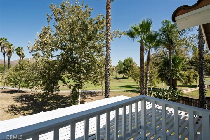 Balcony off of the primary bedroom overlooking the golf course