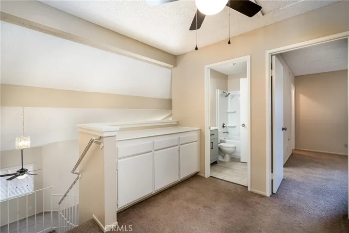 Hallway upstairs with linen storage