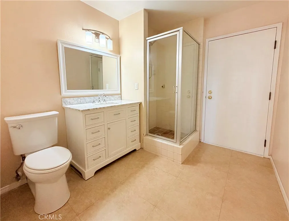 Bathroom Downstairs with door to exit condo