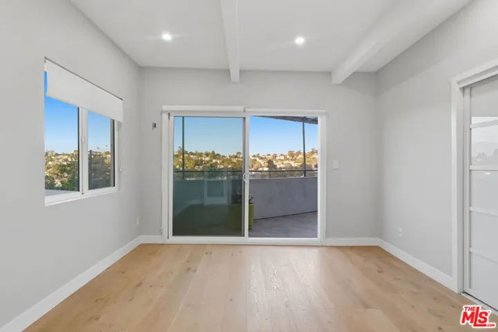Primary bedroom w/ balcony