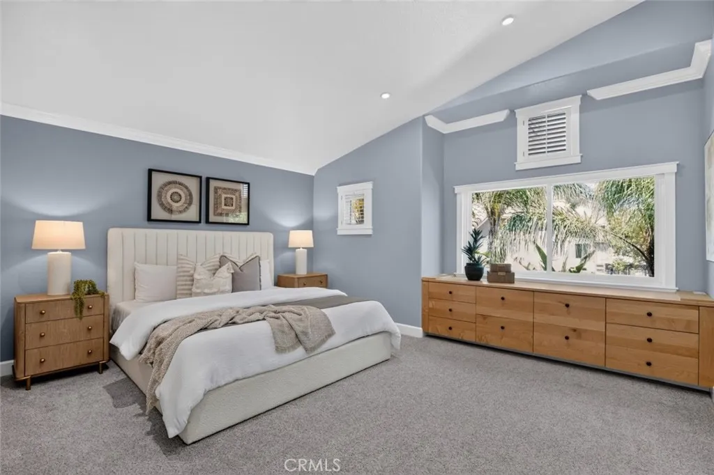 Primary suite with built in cabinetry and vaulted ceilings