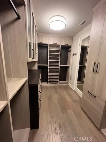 walk in closet in primary bedroom