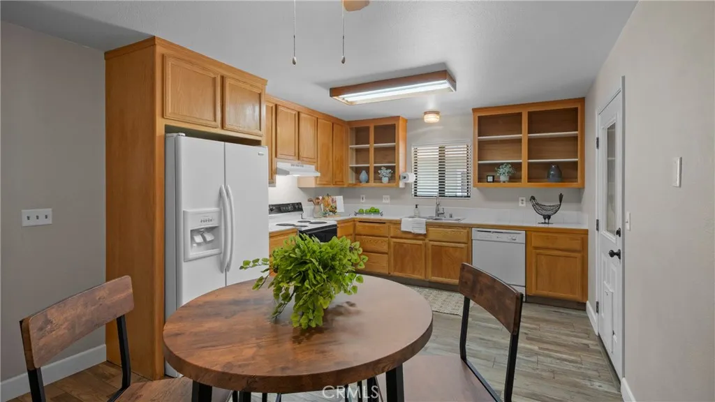 Kitchen features tile counters and a lovely nook for dining...