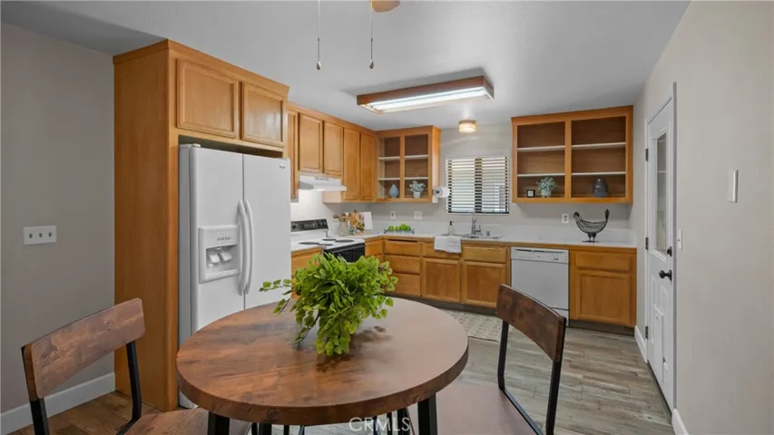 Kitchen features tile counters and a lovely nook for dining...